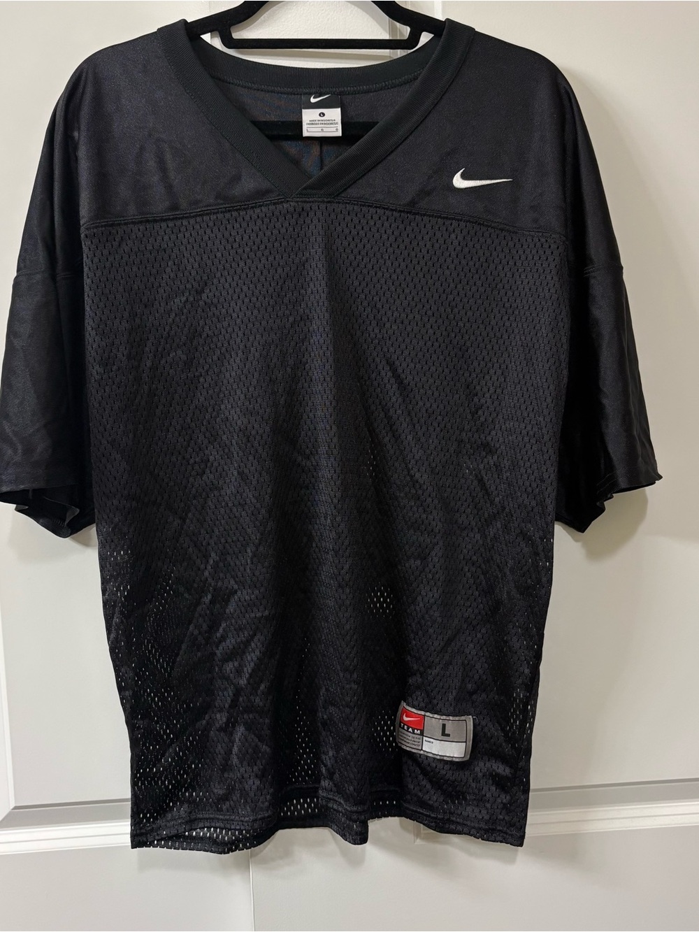 Nike Black Men’s Mesh Athletic Jersey with White Swoosh